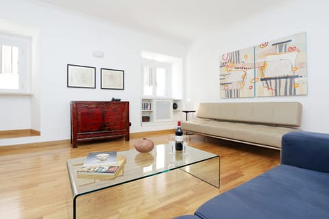Living room - spacious and light, with modern furniture and beautiful artwork.