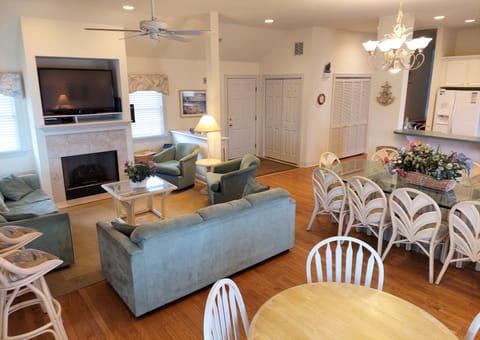 Breakfast/game table, TV area, main dining table, entrance and laundry