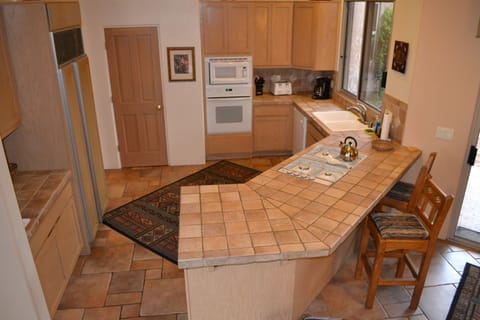Kitchen with built-in Sub Zero refrigerator.