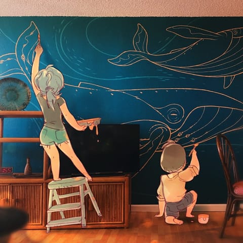 Our nephew and his fiancé (in cartoon form) painting our mural