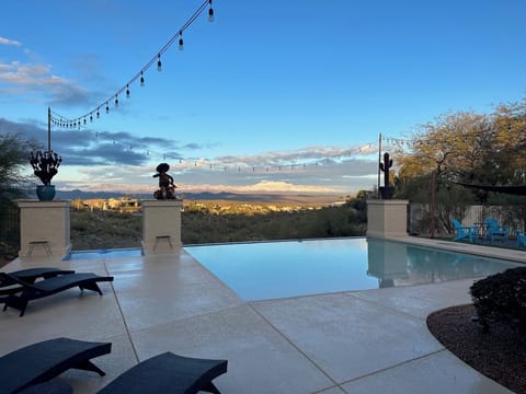 Breathtaking views of the Emerald Wash & Four Peaks in this tranquil backyard.
