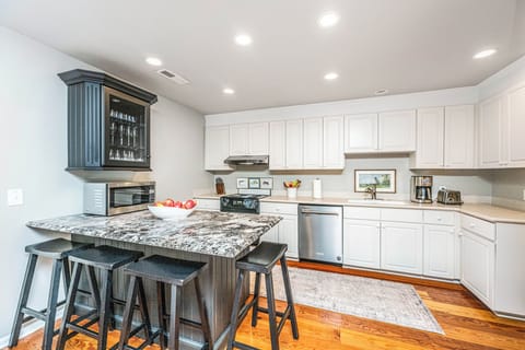 Modern kitchen is fully appointed with plenty of storage and prep space.
