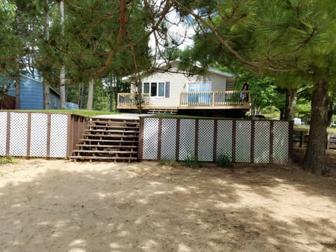 View from lake looking back at house. Lots of room to lay out or play in sand.