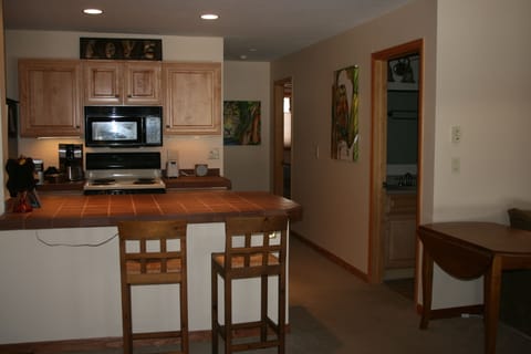 kitchen, hallway to bedrooms, door to bathroom