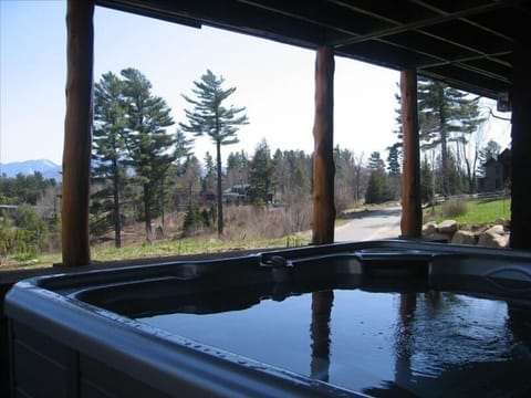 Hot tub is outdoors but provides shelter from rain and snow - great way to relax
