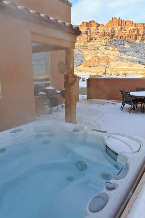 Hot tub with views of the Moab rim in one direction, La Sal Mountains the other.