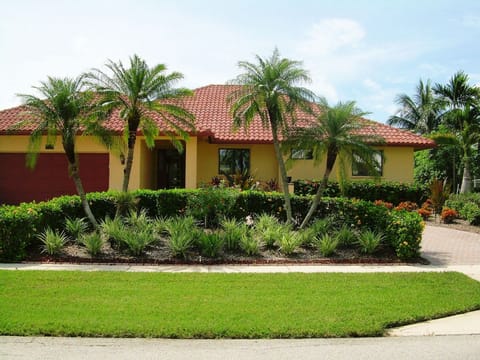 Front of Home with lush landscaping