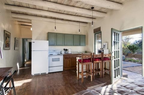 Kitchen w/ Dining Bar (hallway leads to Bath & Bedroom)