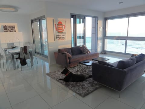 Living room and dining area with sea view