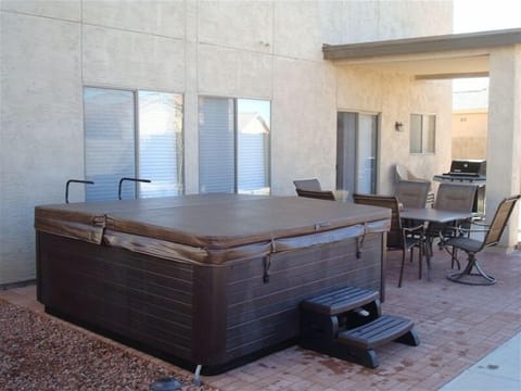 Patio with grill, patio set, & hot tub