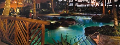 Enjoy the deeply relaxing poolside hot tubs by night...or day.