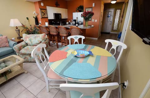 DINING TABLE WITH KITHCEN IN BACK GROUND
