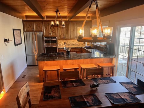 Kitchen with large table seats 6 and island seats 4