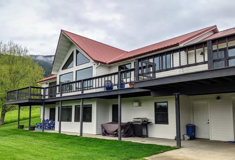 Lower level apartment includes a private patio, outdoor table, and gas grill.