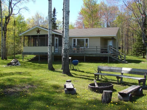 Front of the cabin and fire pit