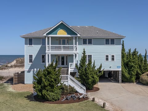  Tidalist's rising sun, welcoming porches and volleyball net from Lighthouse Dr 
