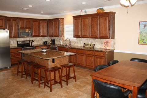 Kitchen / Dining area.  SS appliances and granite counters.