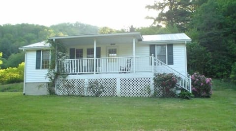 Enjoy the front porch while listening to the birds sing........