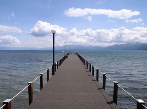View of Lake Tahoe from pier. Grassy area by pier to sunbath or watch sunset. 