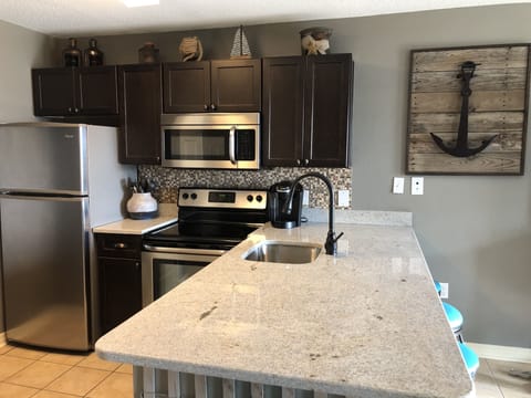 Newly renovated kitchen with solid wood cabinets, granite and stainless steel 
