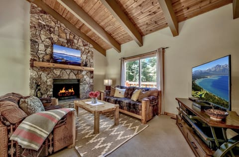 Living room with stone fireplace where you can enjoy a warm cozy fire.