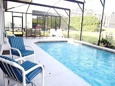 HEATED pool with cover for cool nights (a must in Orlando). Loungers and dining