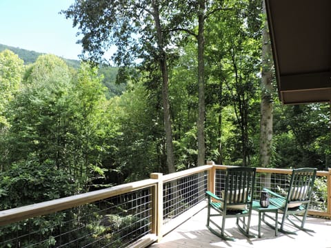 Two rocking chairs on the back deck.