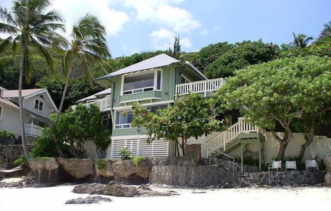 Front view of the house from secluded white sandy beach