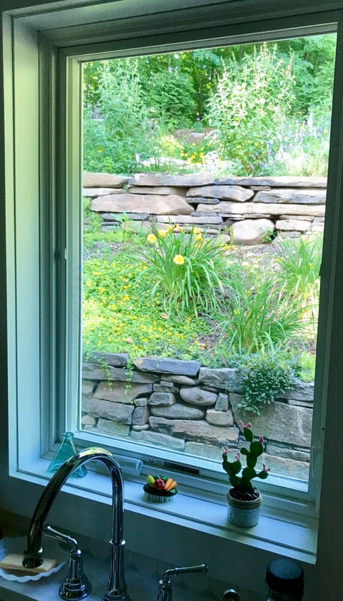 View from Kitchen Window of Summer Flowers and Terraced Rock Garden