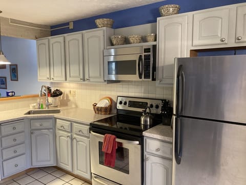 Our kitchen has a large fridge, stove and dishwasher.