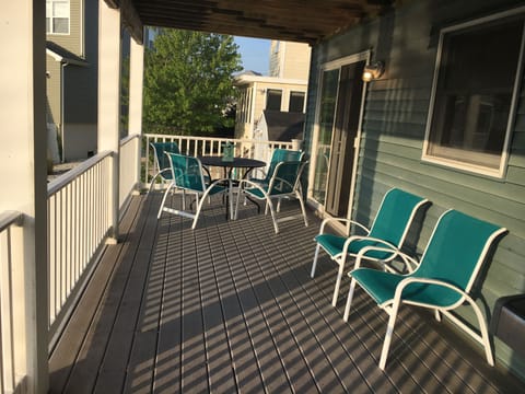 Large lower deck with partial shade for sitting and dining.