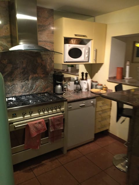 kitchen showing stove, dishwasher and microwave