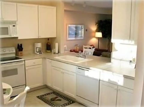 Fully stocked kitchen with a view thru to my Family Room
