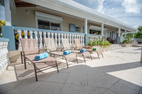 Upper pool deck with plenty of chairs for sunbathing