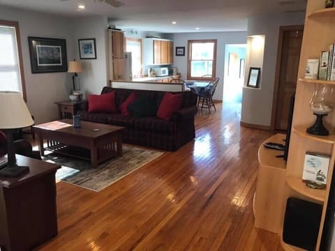 Open floor plan with hardwood floors throughout. 