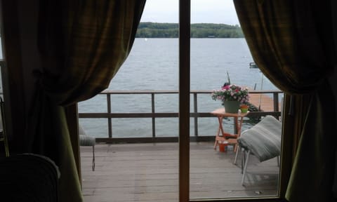 Sliding glass door out to the deck from Kitchen.  6 lounge chairs and umbrella