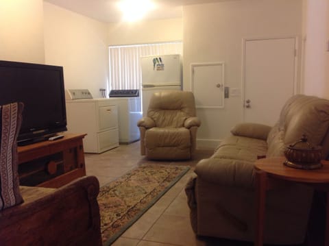 Den with extra refrigerator and washer/dryer