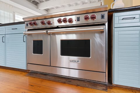 Six burner Wolf Stove with built in grill. For easy to serious cooks.