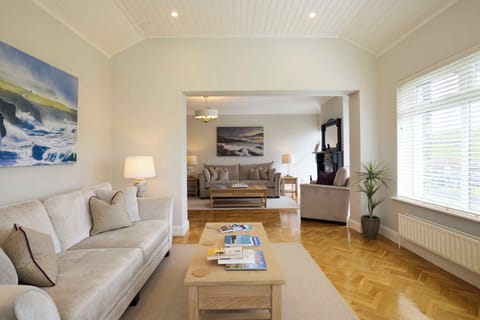 Large lounge and sunroom. Comfy couches with wonderful countryside views