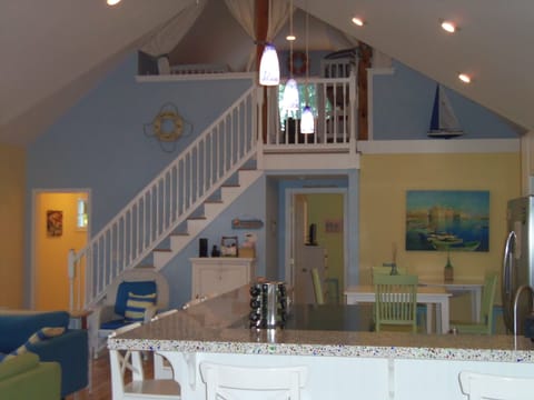 View to upstairs loft, with 2 sets of wood framed twin bunk beds