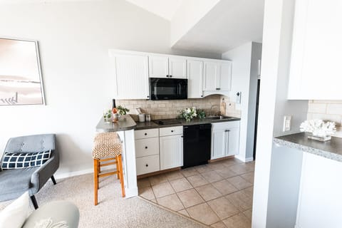 Mini Kitchen with stove, microwave, refrigerator, washer and lg toaster oven.