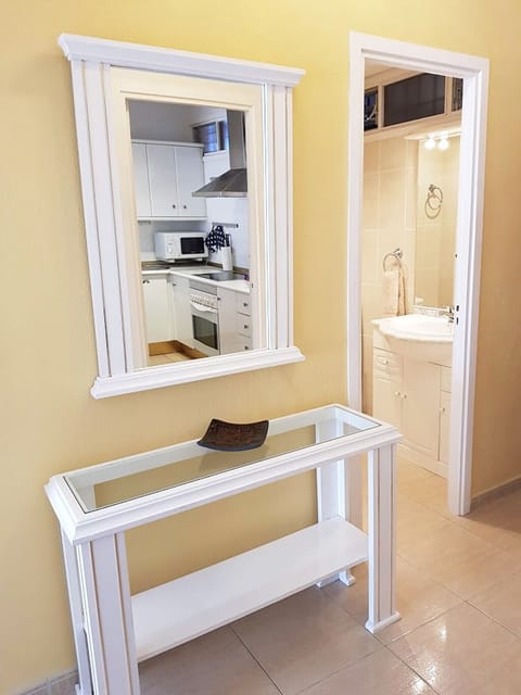 Entrance Hall. View from lounge towards bathroom. Security door