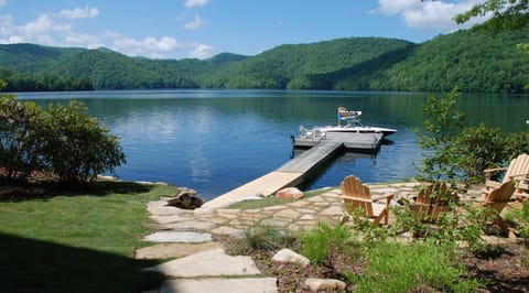 Private dock, patio with fire pit, walkway to lake.
