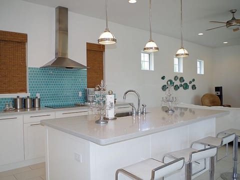 kitchen is stocked full of stainless steel appliances and has plenty of kitchen