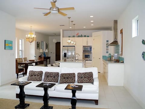 Living room is located directly off of the kitchen and dining areas