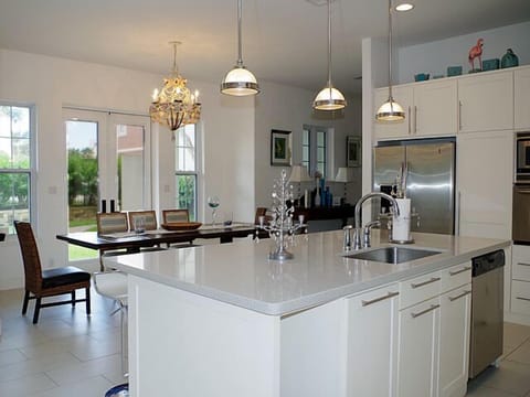 Open concept kitchen with large island and bar seating for six