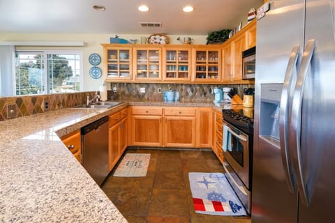 This high-end kitchen is fully equipped to prepare a gourmet meal.