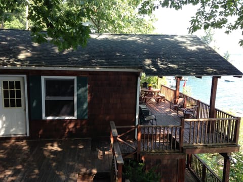 Beautiful covered deck with dining table for 8 and added seating
