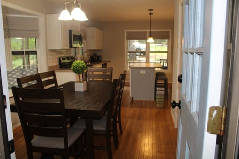 Walk into the roomy dining room & kitchen from the screen porch