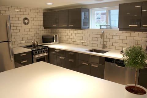 Kitchen features full size refrigerator, DW, 20' range, microwave, and coffee maker.